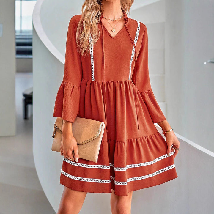 Casual mini dress for women with V-neck, decorative sleeve cuffs and playful hem Lune London
