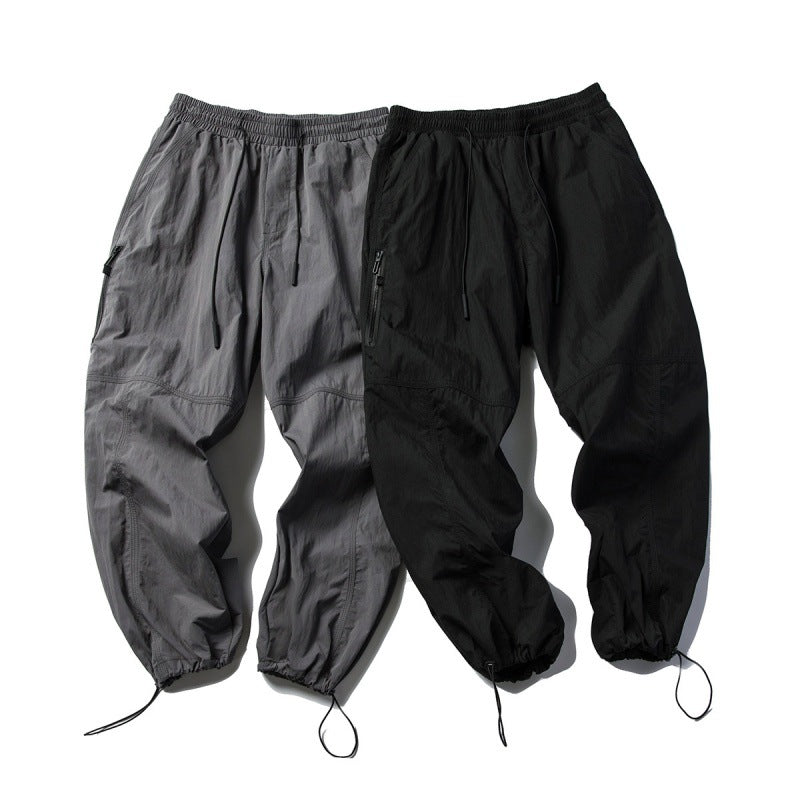 Unisex Technical Cargo Pants in Baggy Cut with Drawstring Waist and Adjustable Leg Closures Amarae