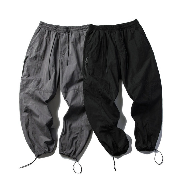 Unisex Technical Cargo Pants in Baggy Cut with Drawstring Waist and Adjustable Leg Closures Amarae