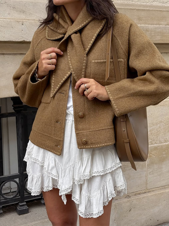 Women's short jacket made of wool blend with a suggested shawl collar, decorative seams, and boxy cropped cut Amarae