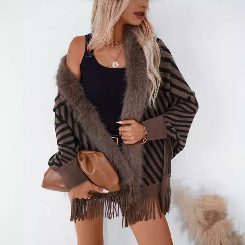 Ladies knitted poncho with elegant faux fur collar and fringe design Amarae