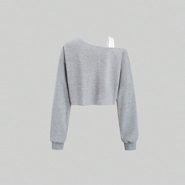 Sweat-shirt court pour femmes avec design asymétrique et manches volumineuses Chic & Stil