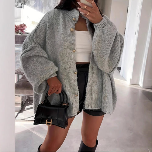 Oversized knit jacket for women with elegant puff sleeves and a chic button placket
