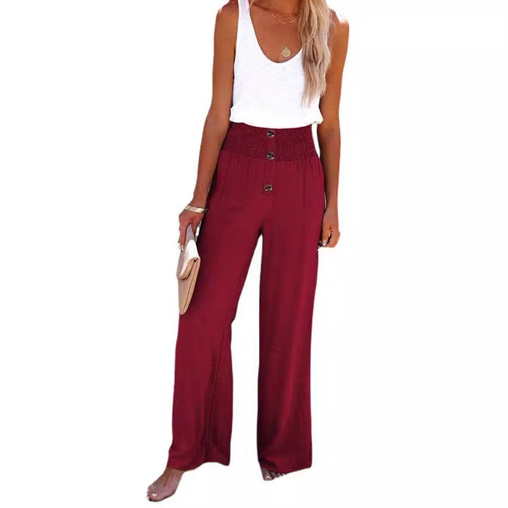 Women's wide-leg linen pants with elastic waistband and button details Lune London