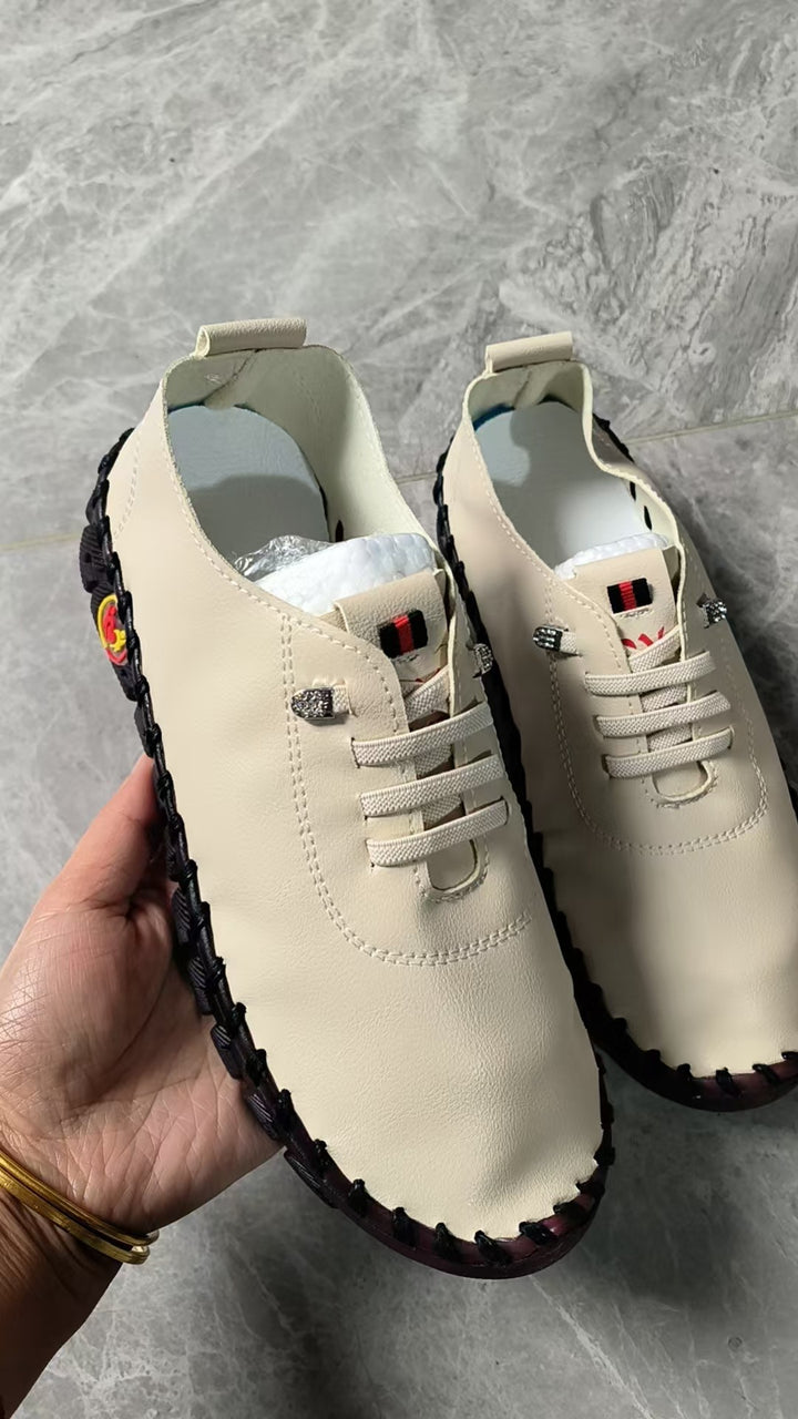 Women's lightweight, soft slip-on with hand-stitched rubber sole and elastic lacing Amarae
