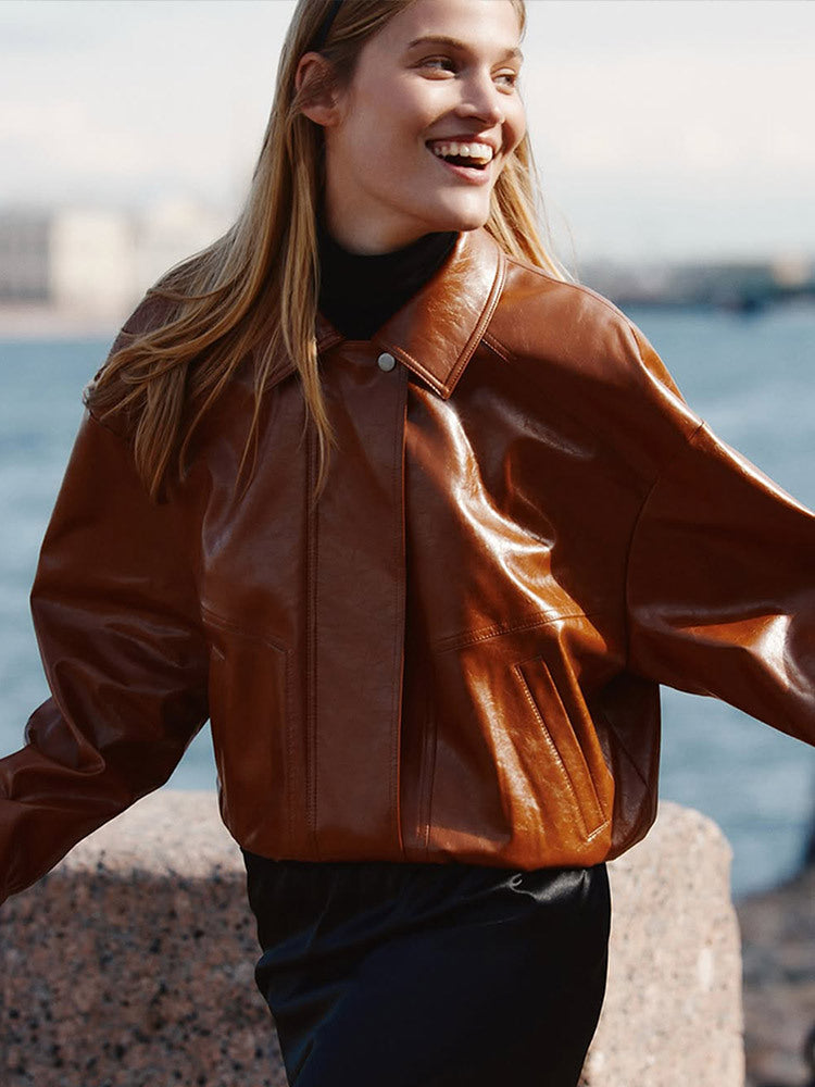 Women's short blazer made of vegan smooth leather with boxy silhouette and concealed snap button placket Amarae