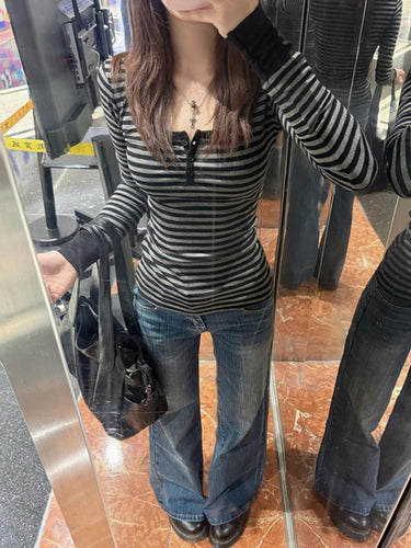 Women's long sleeve shirt with modern striped pattern and decorative button details Chic & Stil
