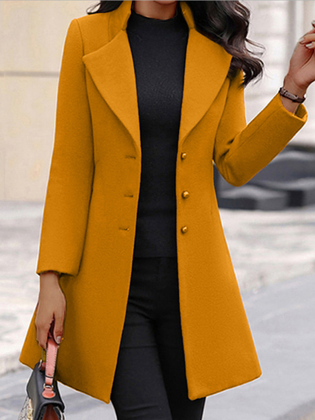 Elegant trench coat for women with a wide lapel and a chic button design.