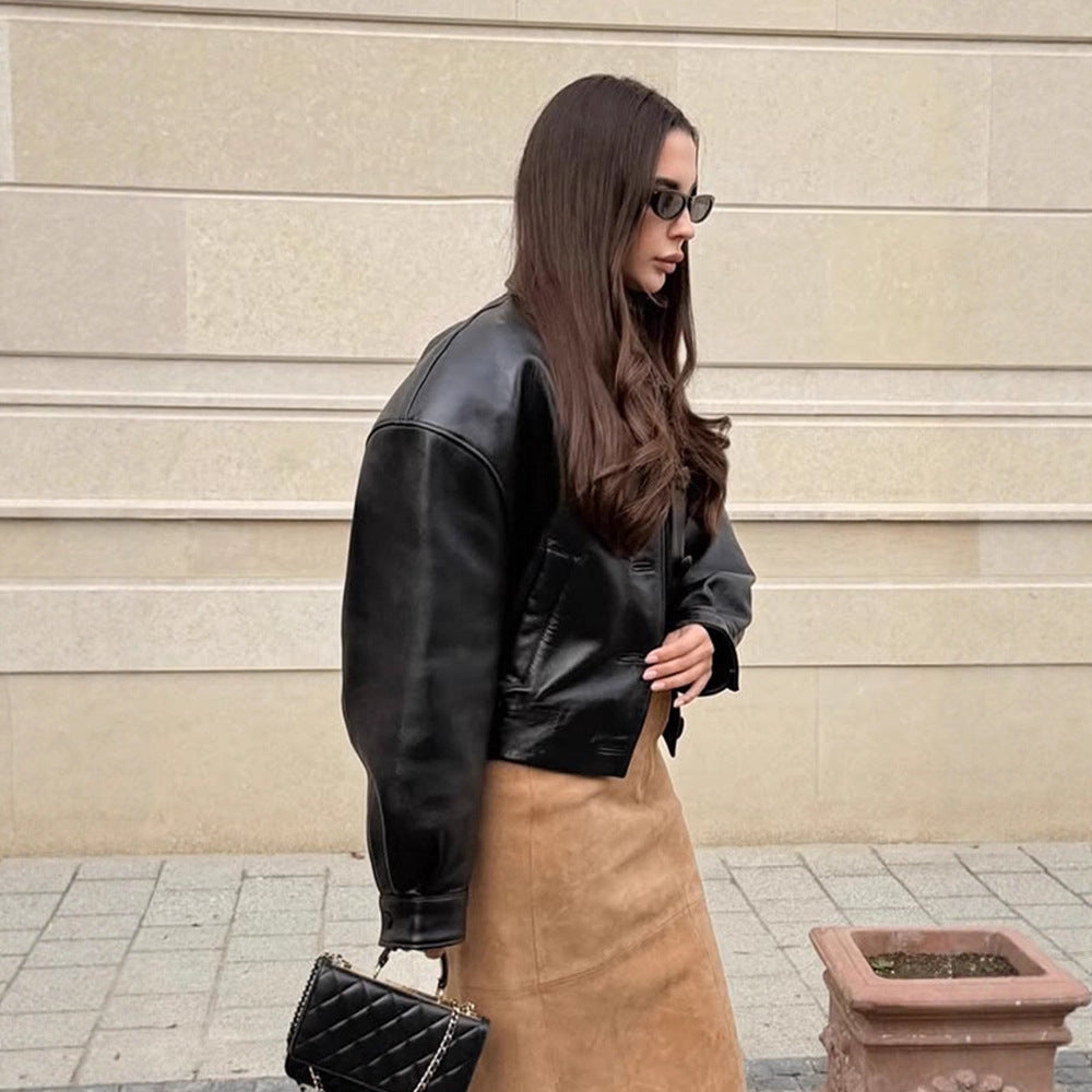 Women's short jacket made of vegan leather imitation in boxy cut with oversized shoulders and hidden button placket Amarae