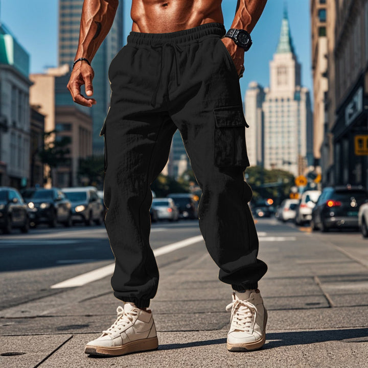 Men's cargo training pants with elastic waistband and practical side pockets Lune London