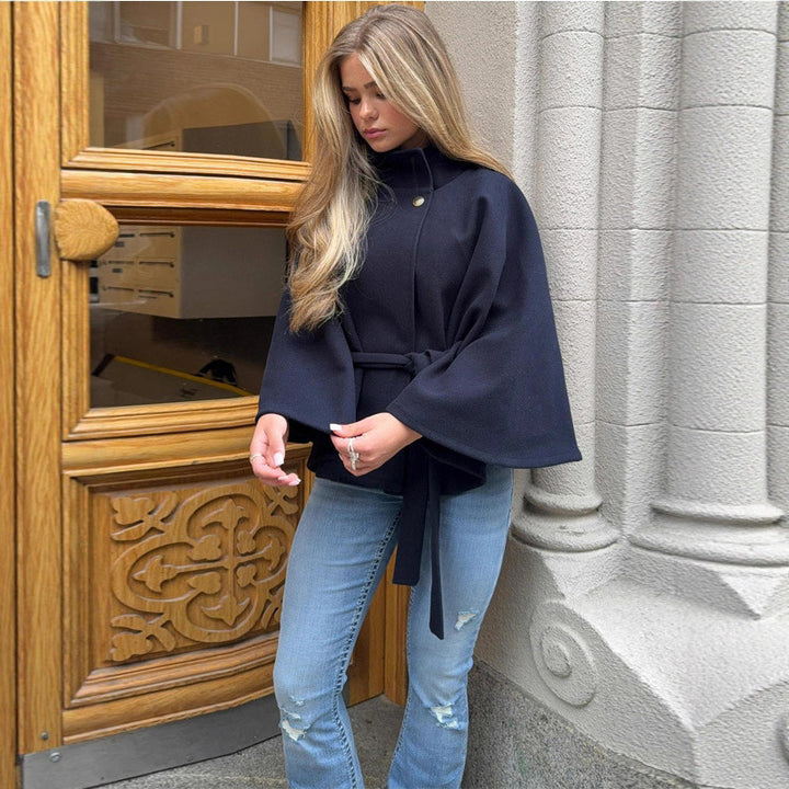 Women's short cape made of wool blend with asymmetric stand-up collar and waist tie belt Amarae