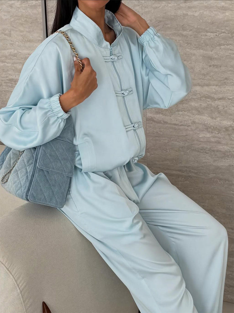 Women’s satin two-piece with traditional toggle closures and wide pants skirt Amarae