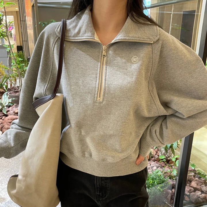 Pull à capuche stylé pour femme avec demi-zip Chic & Stil
