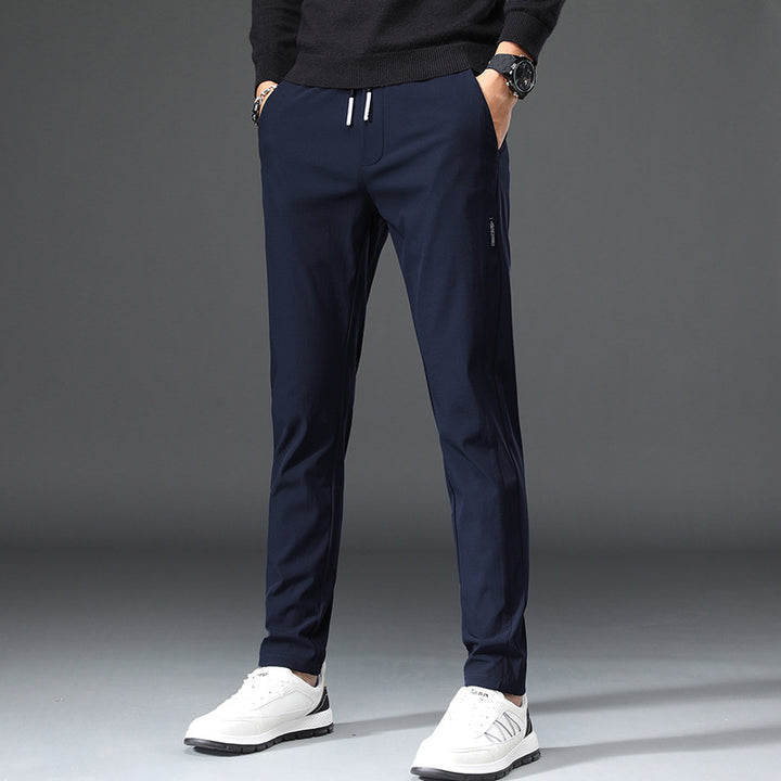 Men's slim fit sports pants with elastic waistband and practical zip pockets Lune London