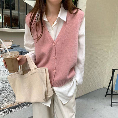 Gilet en tricot pour femmes avec un élégant col en V et fermeture à boutons Chic & Stil