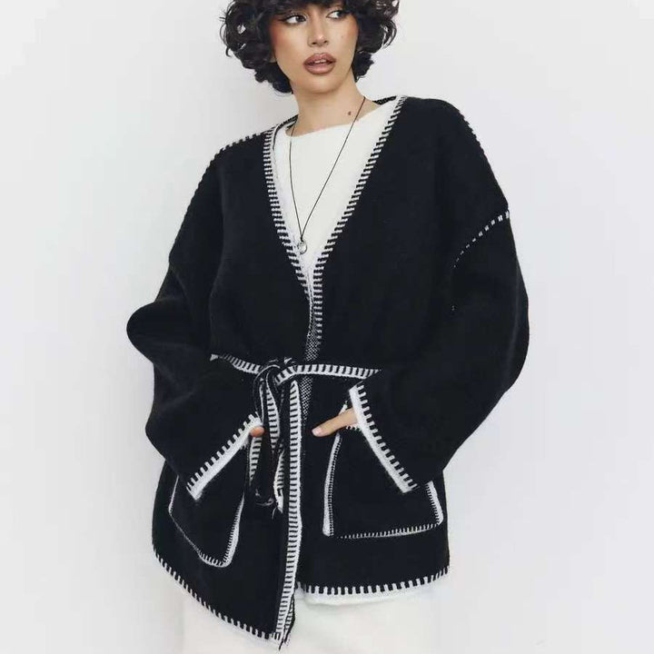 Loose fit knitted women's jacket with decorative belt Lune London