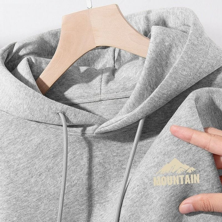 Women's hoodie with modern mountain motif and practical pockets Chic & Stil