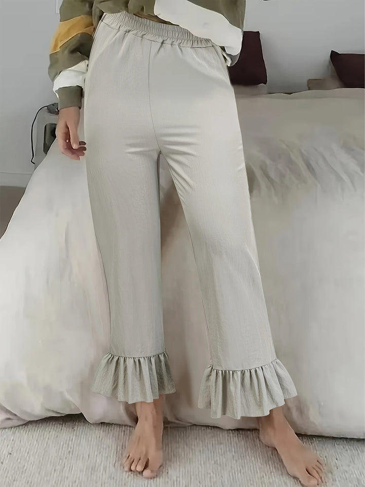 Women's flared pants with playful ruffle details Lune London