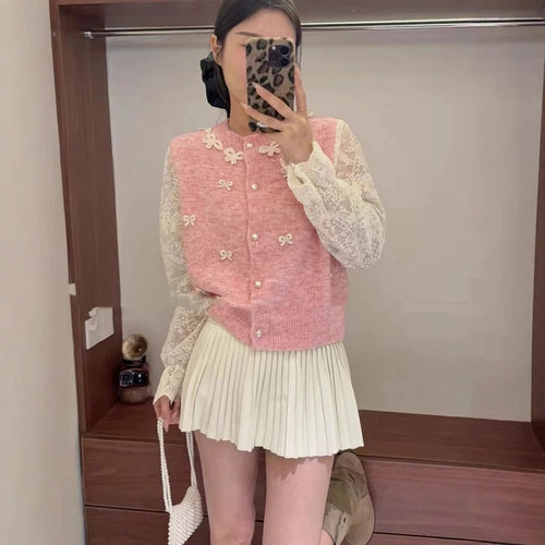 Women's knitted jacket with elegant lace details and a bow Amarae