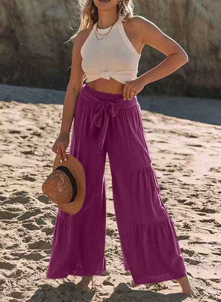 Airy palazzo pants for women with elastic waistband and practical tied belt Lune London