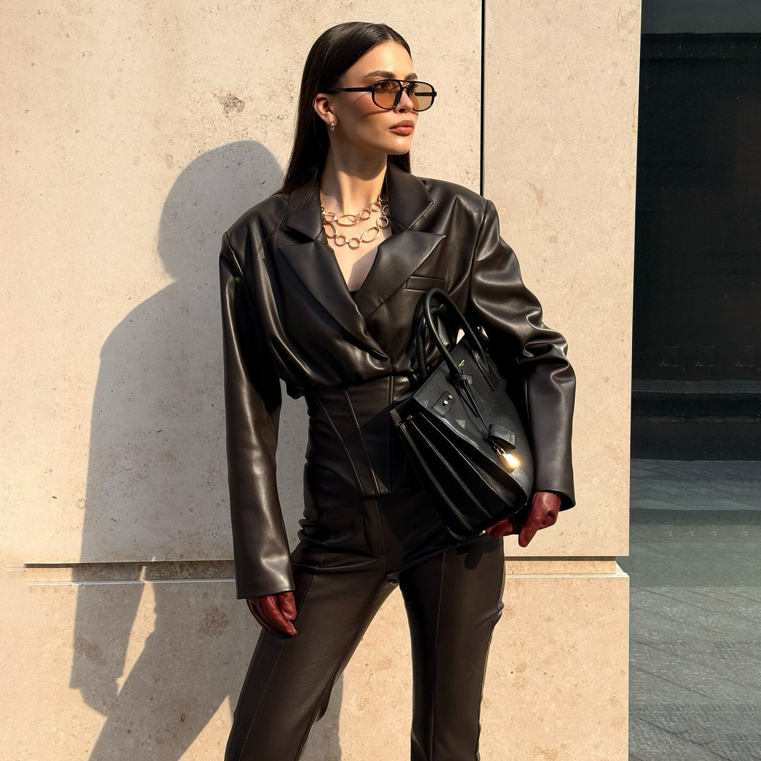 Elegant leather jacket for women with trendy blazer and slim pants