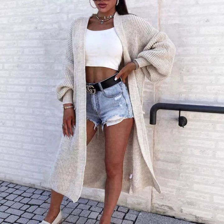 Long knitted coat for women with oversized sleeves and practical pockets Lune London