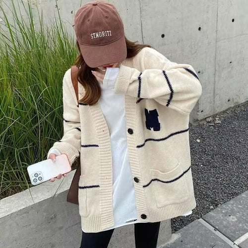Lady knit vest with two patch pockets and contrasting stripes Amarae