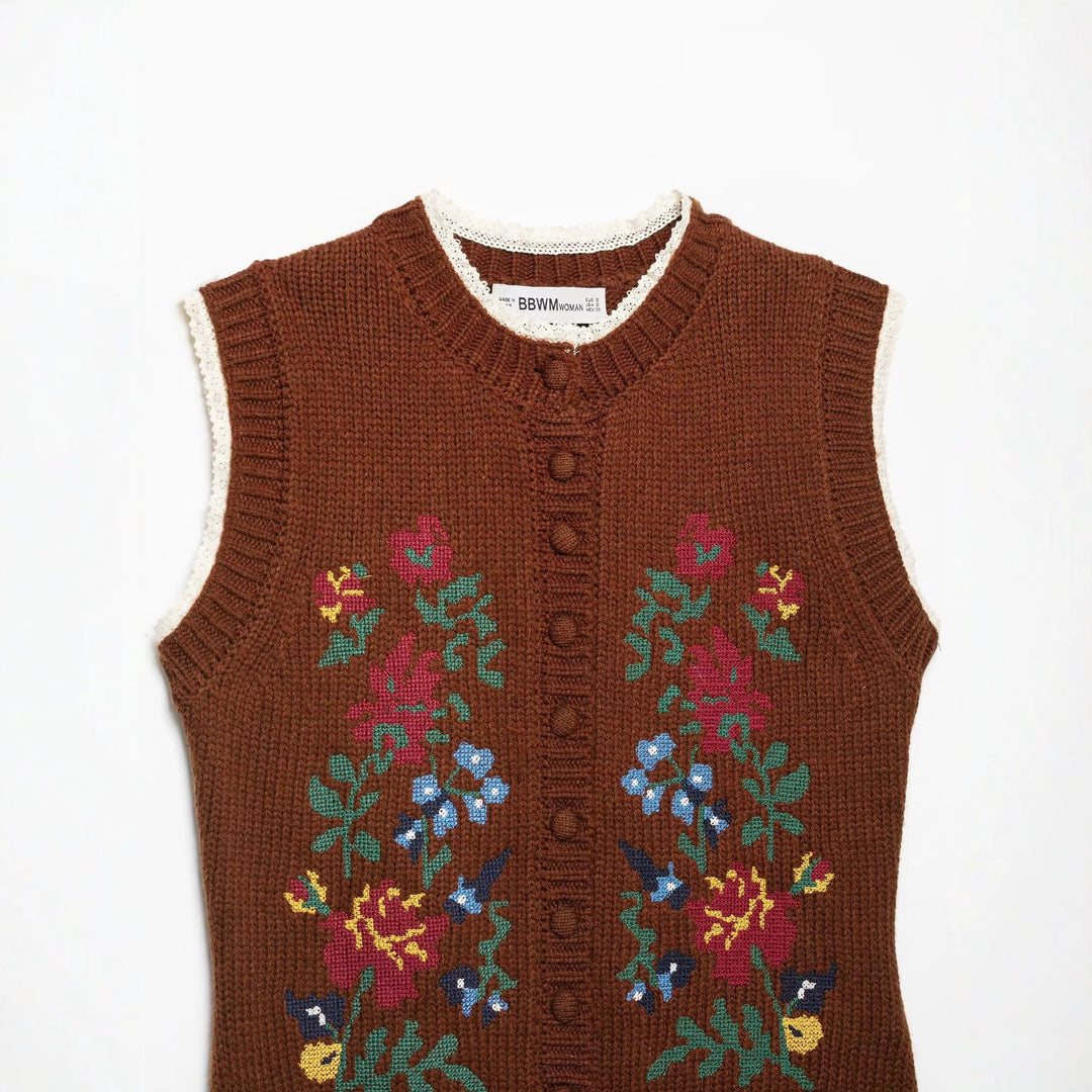 Women's sleeveless knitted vest with floral intarsias, button placket and crocheted hem Amarae