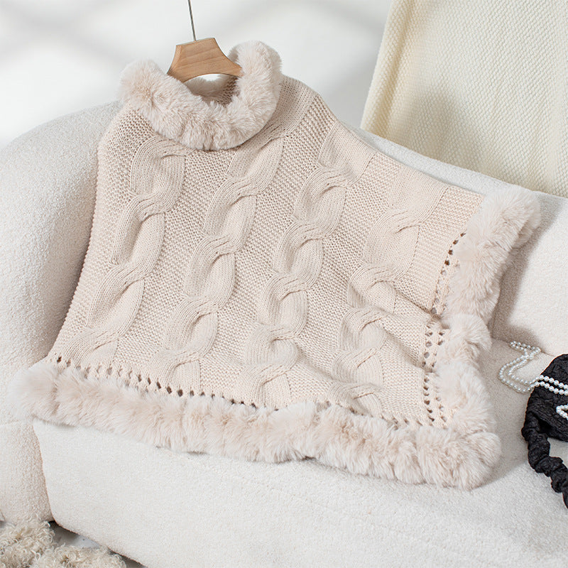 Ladies cozy poncho sweater with soft faux fur trim and cable knit pattern Lune London