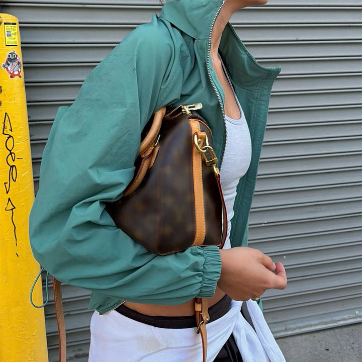 Ladies sporty-urban windbreaker with short cropped cut, high stand-up collar and elastic cuffs