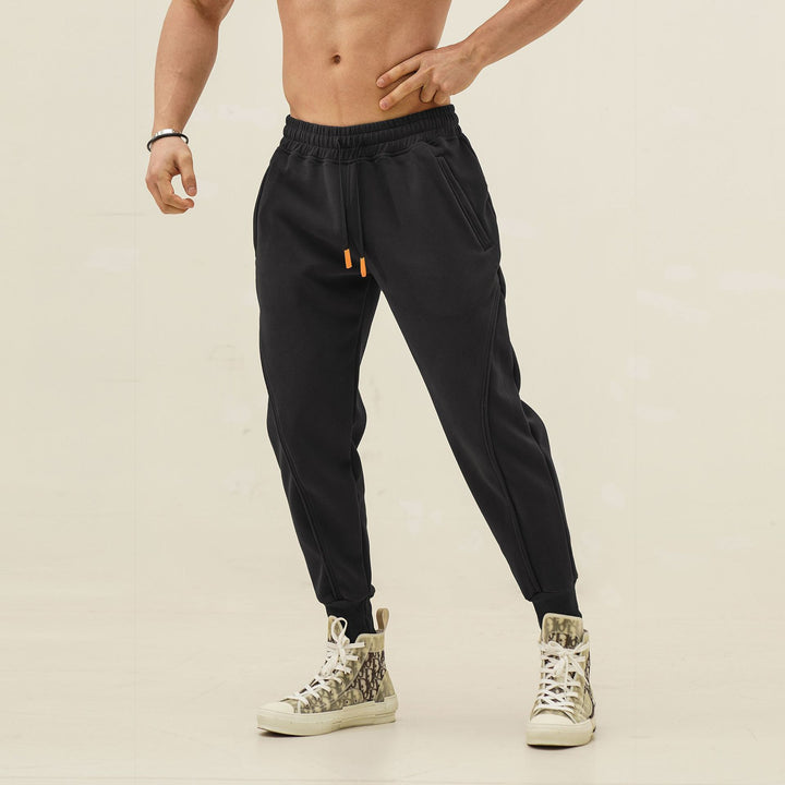Sporty jogger pants for men with elastic waistband and stylish contrasting stripes Lune London