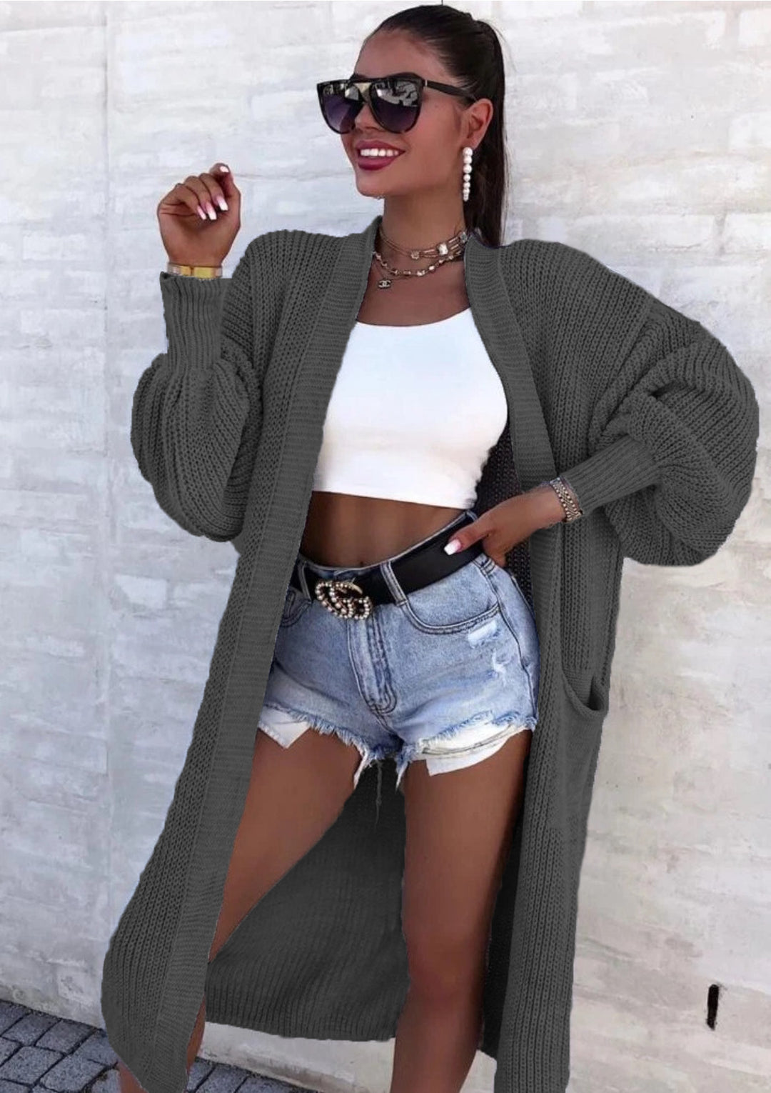 Long knitted coat for women with oversized sleeves and practical pockets Lune London