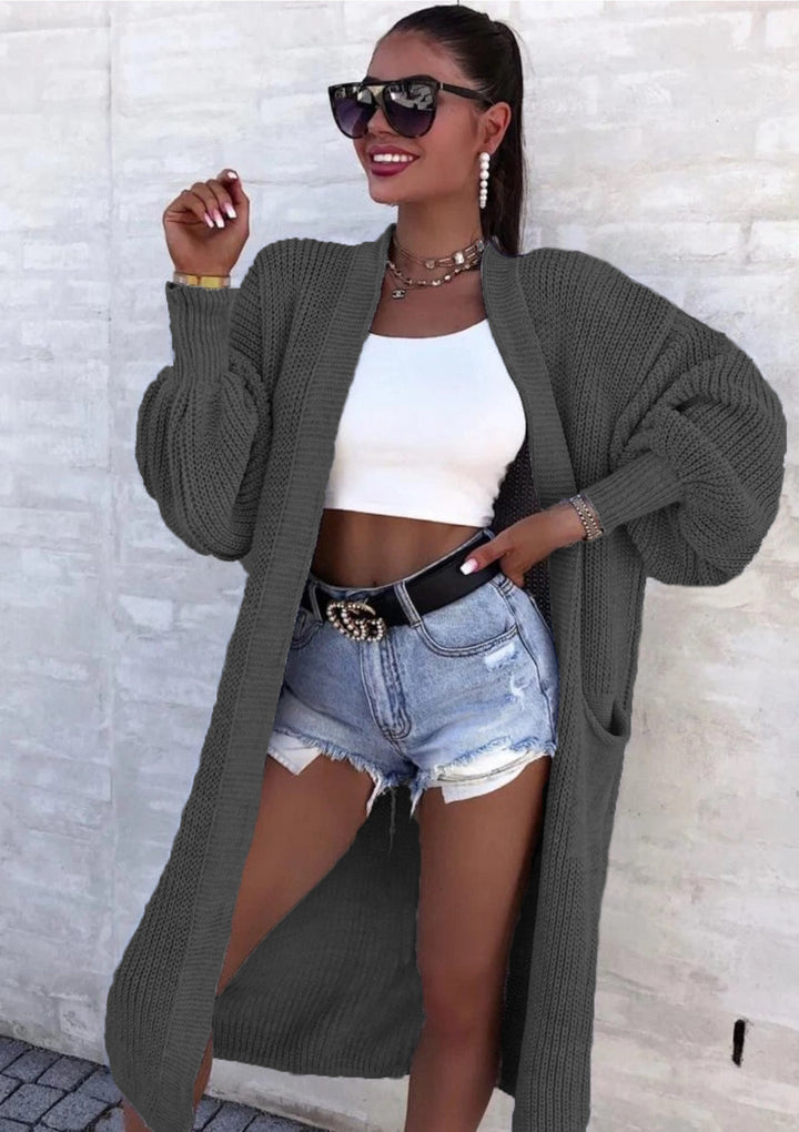 Long knitted coat for women with oversized sleeves and practical pockets Lune London
