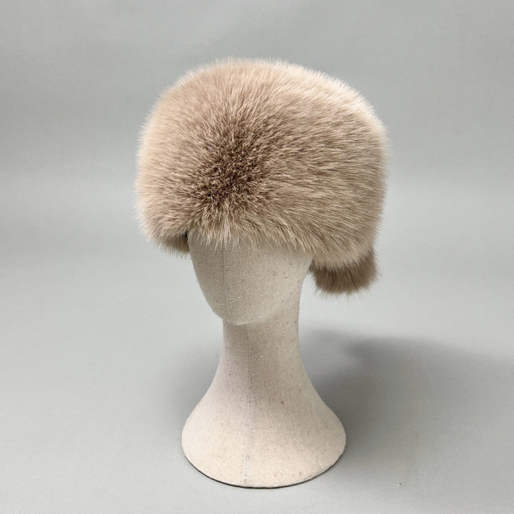 Women’s plush faux fur trapper hat with earflaps and decorative tail Amarae