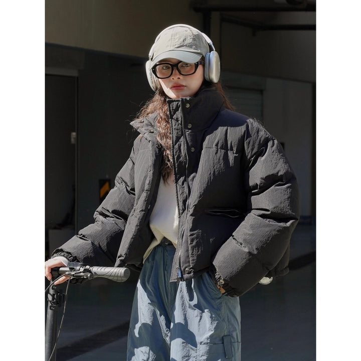Women's short-cut padded down jacket with high collar and matte nylon surface Amarae