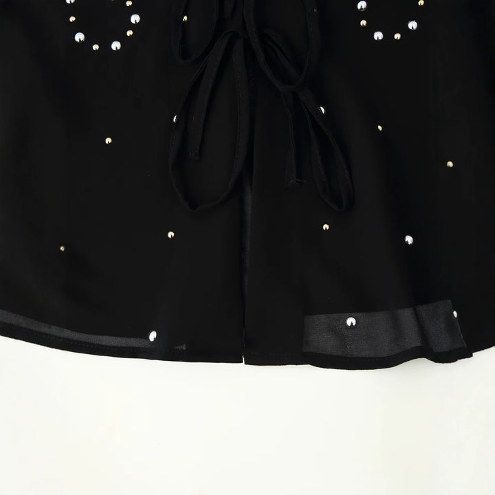 Women’s chiffon blouse with sequin trim, deep V-neck and decorative tie bands Amarae