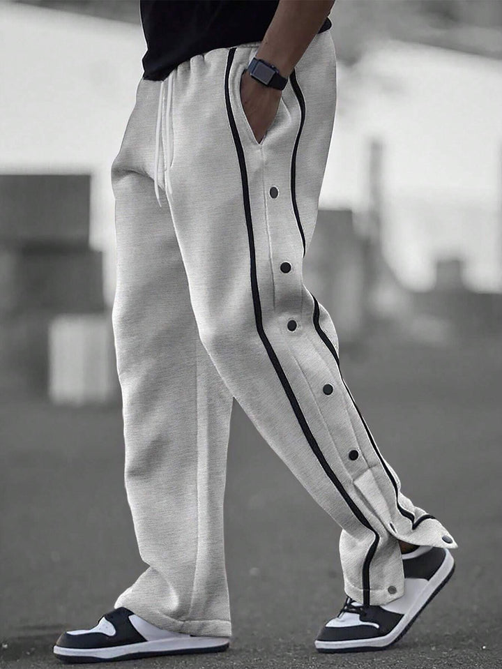 Stylish men's sports pants with snap button details and side pockets Lune London