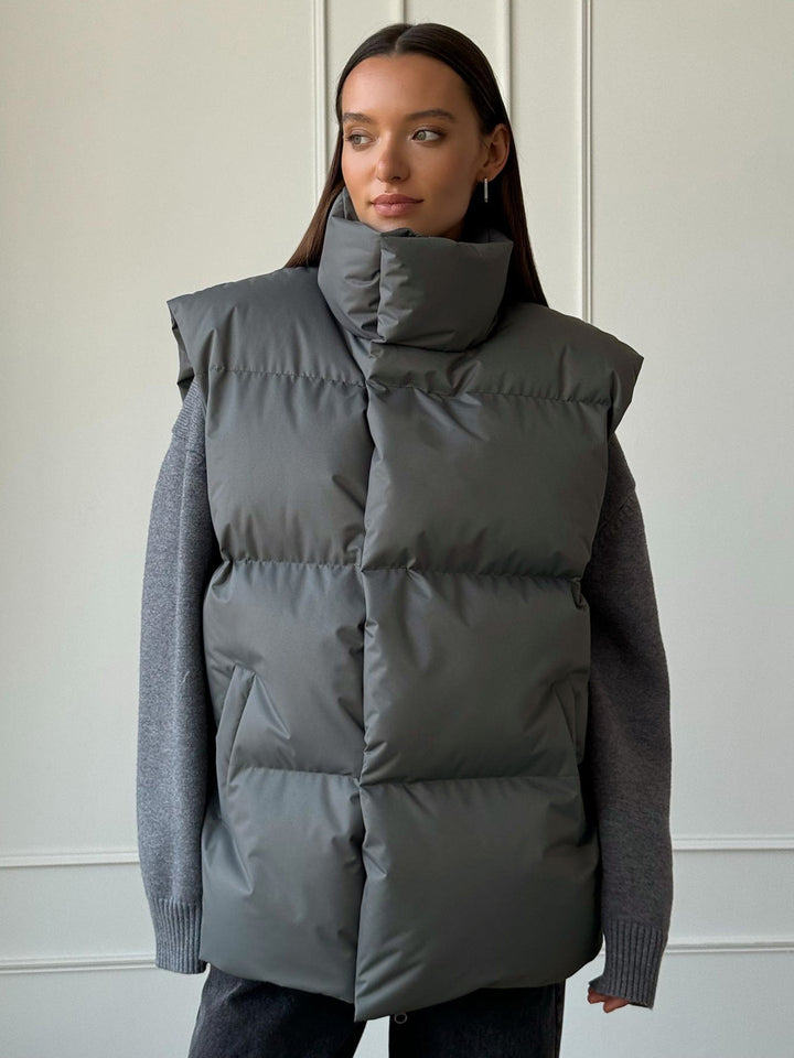 Ladies padded vest with high collar and practical side pockets Lune London