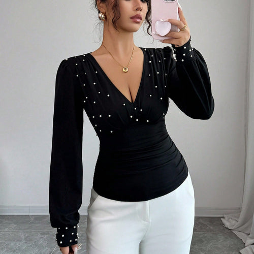Chemisier élégant pour femmes avec décolleté en V et décoration Chic & Stil