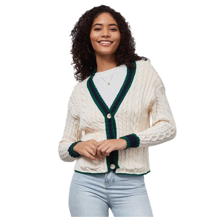 Chunky knit cardigan for women with decorative button placket and matching hem.