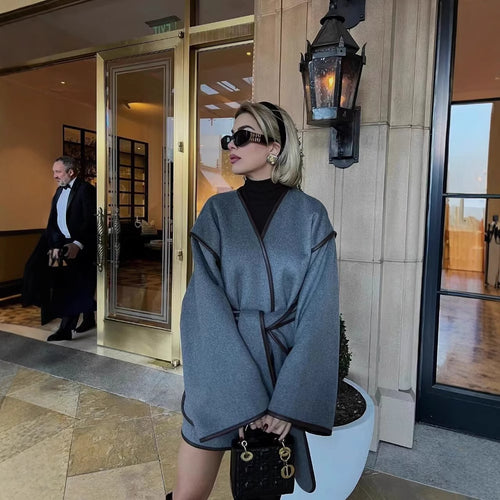 Wrap jacket for women with a modern design featuring practical pockets and a tie belt Amarae