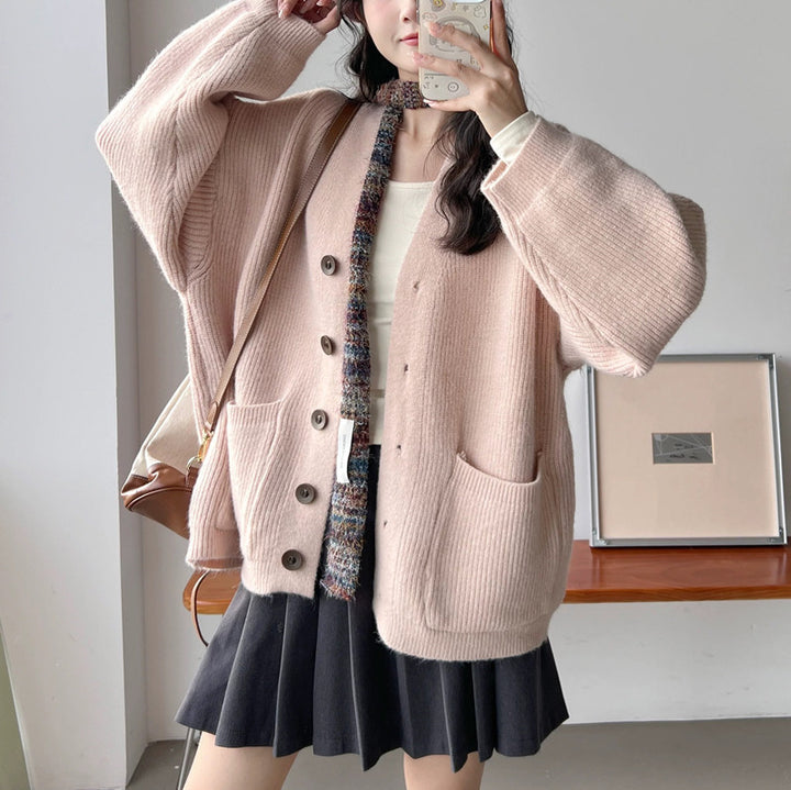 Cardigan en tricot épais pour femmes avec des détails de boutons élégants et des poches pratiques Chic & Stil