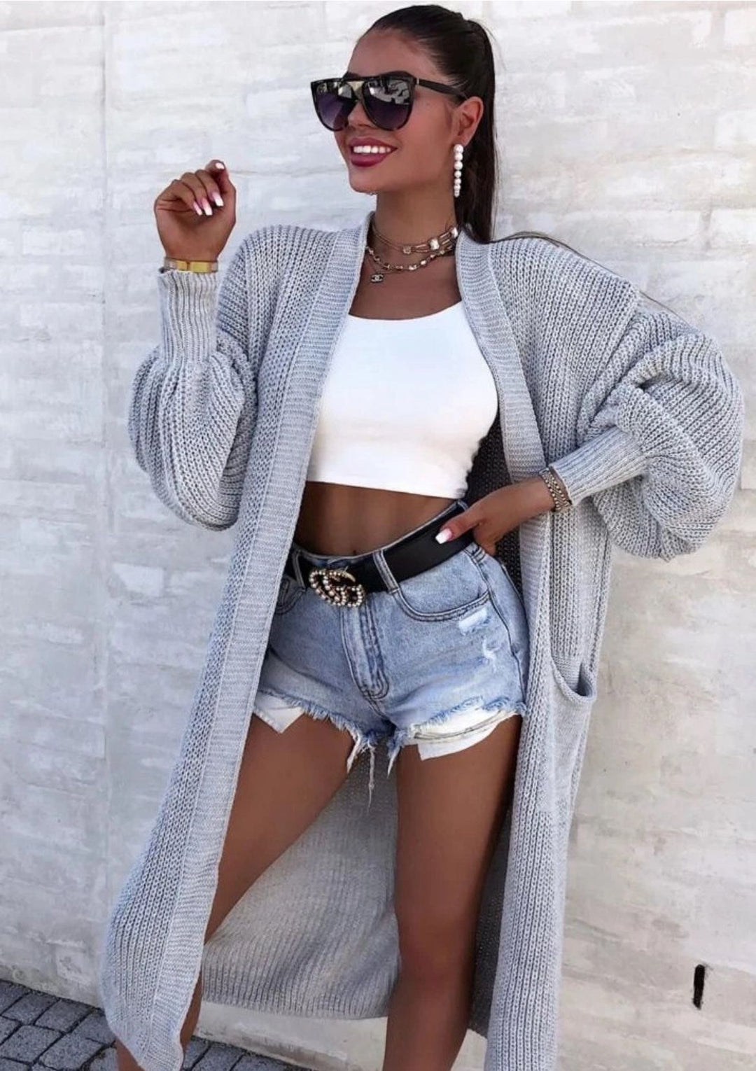 Long knitted coat for women with oversized sleeves and practical pockets Lune London
