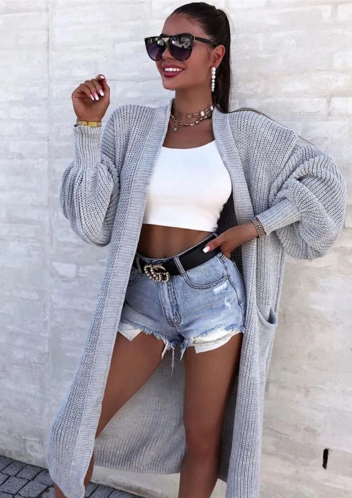Long knitted coat for women with oversized sleeves and practical pockets Lune London