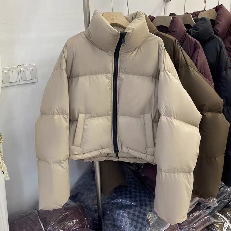 Ladies short functional quilted jacket with high collar and side pockets Amarae
