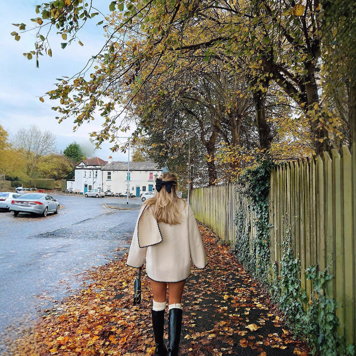 Women’s coat with fringe detail and elegant row of buttons Lune London
