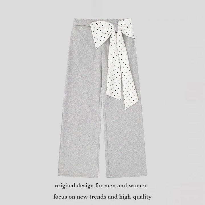 Women's culotte joggers with wide legs and decorative polka dot bow detail