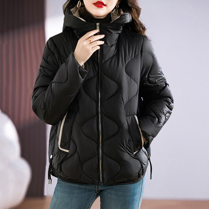 Insulated quilted jacket for women with high collar and practical zip pockets Lune London