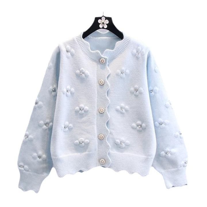 Ladies playful knit vest with decorative pearl buttons and floral design Lune London