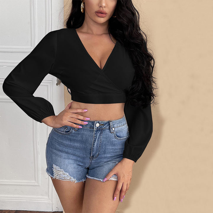 Top cropped féminin avec décolleté en V profond et manches bouffantes élégantes Chic & Stil
